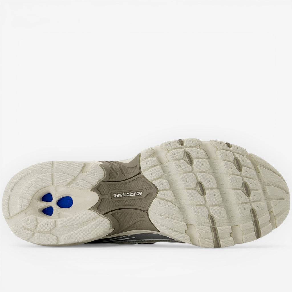New Balance sneaker outsole featuring cushioned sole and blue accents, footwear closeup