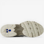 New Balance sneaker outsole featuring cushioned sole and blue accents, footwear closeup