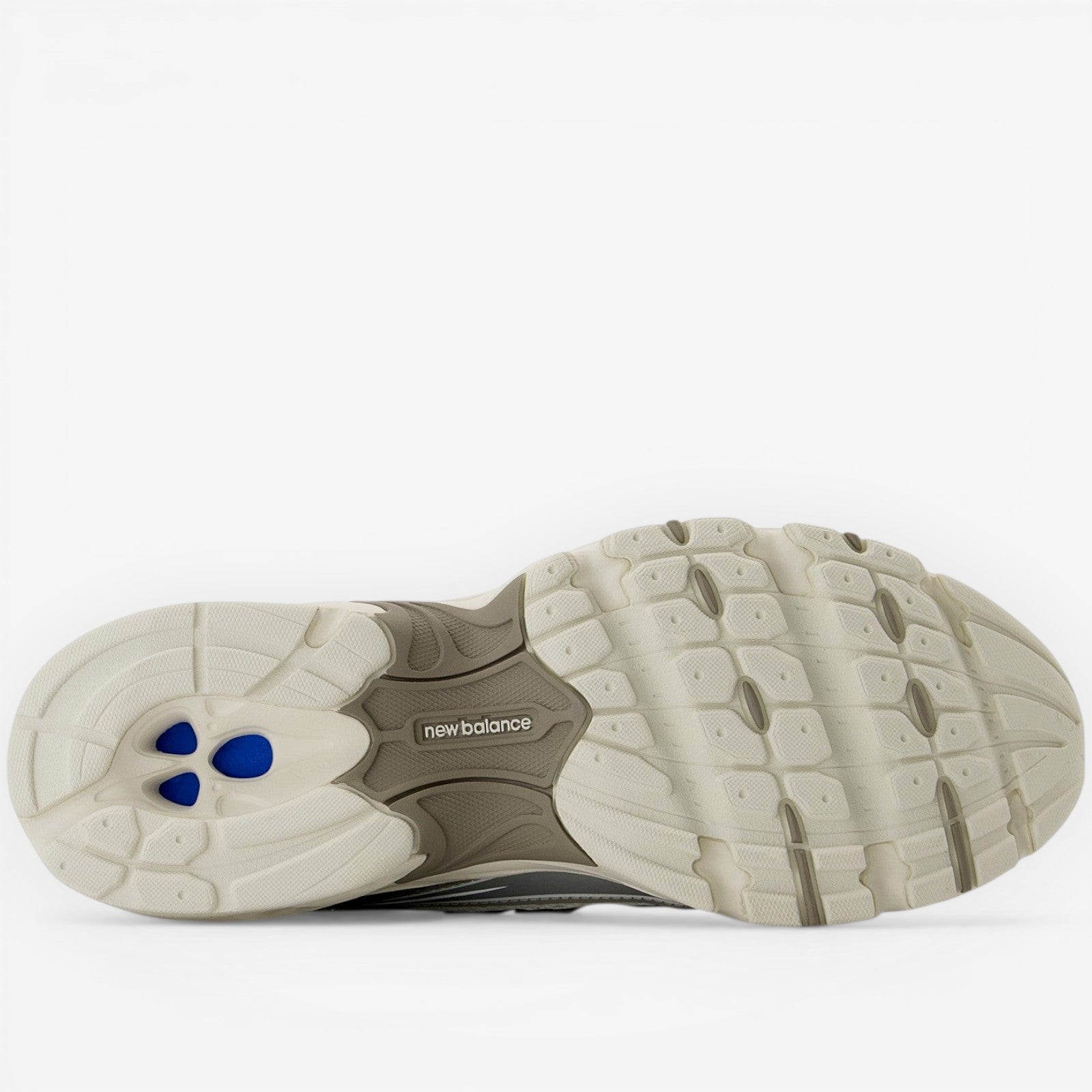 New Balance sneaker outsole featuring cushioned sole and blue accents, footwear closeup