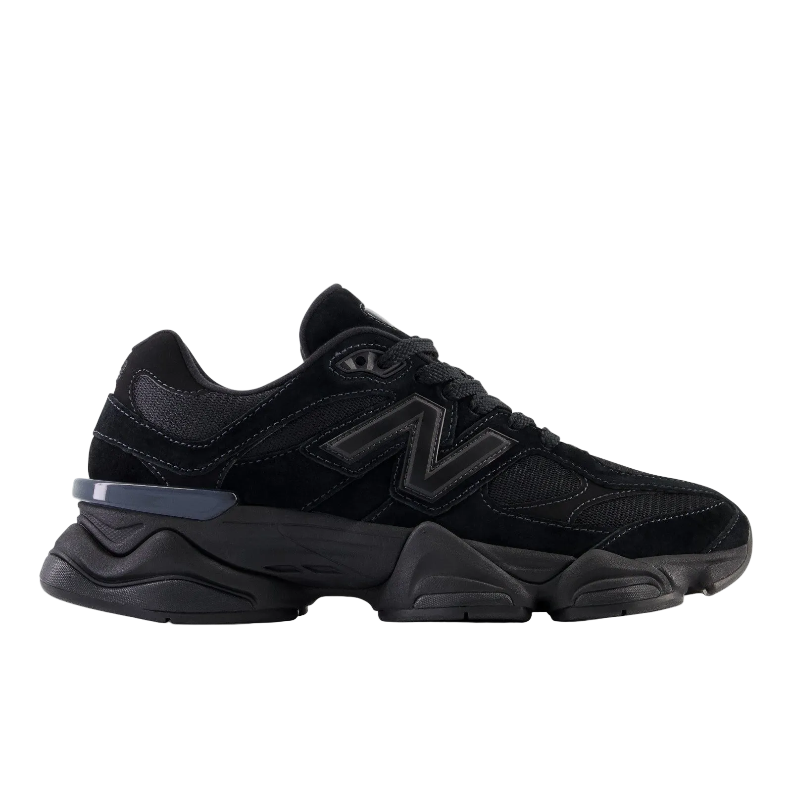Black New Balance sneaker with chunky sole, mesh and suede details, side logo visible