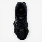 Top view of black New Balance sneaker with mesh and suede details, perfect for footwear lovers.